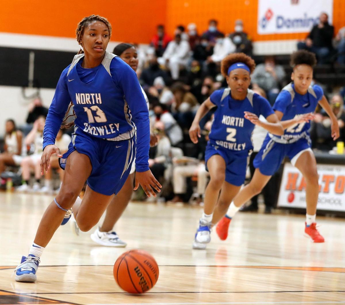 North Crowley forward Jade Goynes (13) drives the ball down court during the second half of a 6A Region 1 Bi-district girls basketball game at Haltom High School in Haltom City, Texas, Friday, Feb. 12, 2021. North Crowley defeated Fossil Ridge 44-41. (Special to the Star-Telegram Bob Booth)