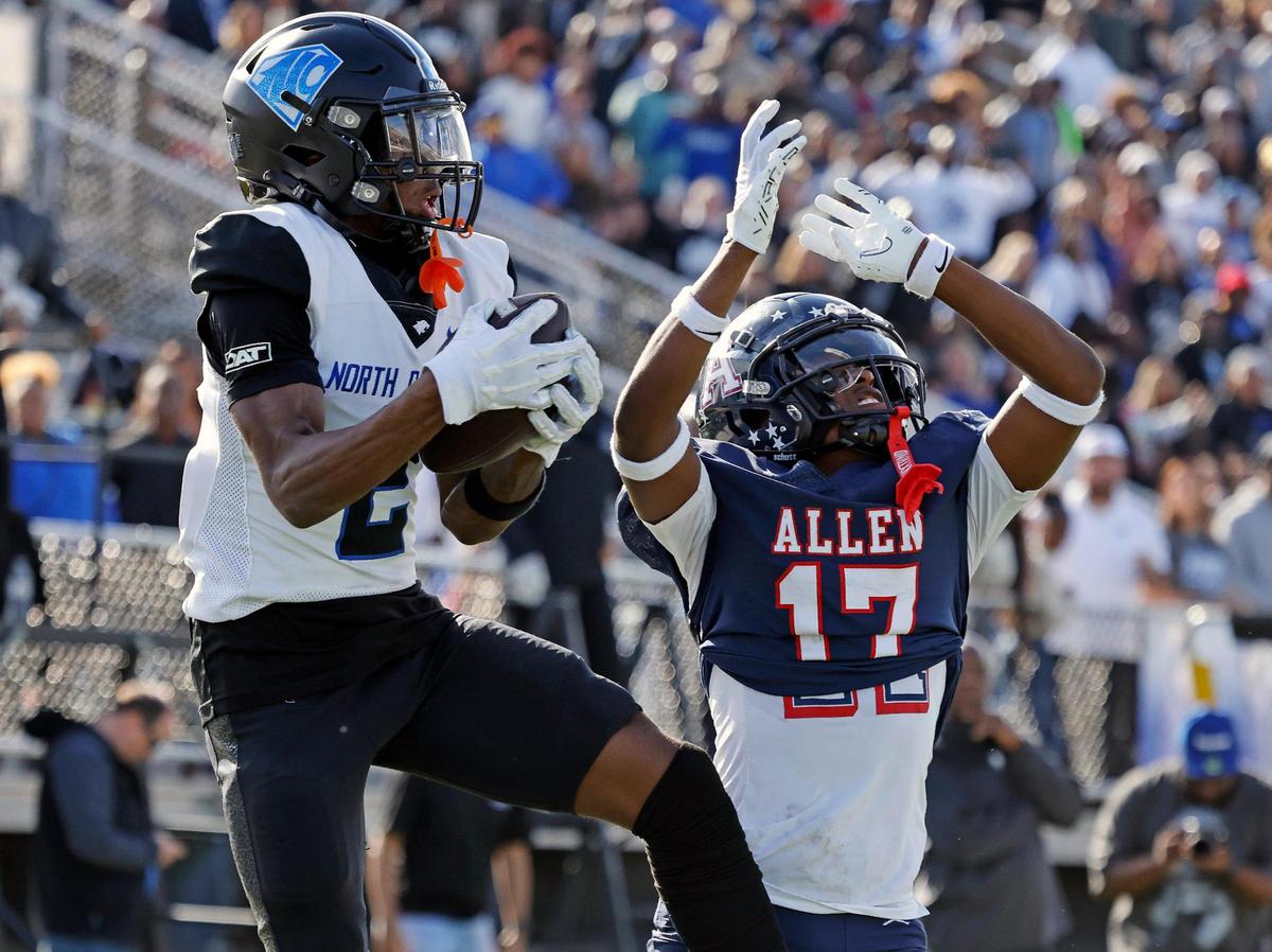 North Crowley wide receiver Mason Ferguson (2) catches a touchdown pass over the head of Allen defensive back Kai Wheaton (17) during the first half of a UIL Conference 6A Division 1 quarterfinal football playoff game at Dragon Stadium in Southlake, Texas, Saturday, Dec. 02, 2023.