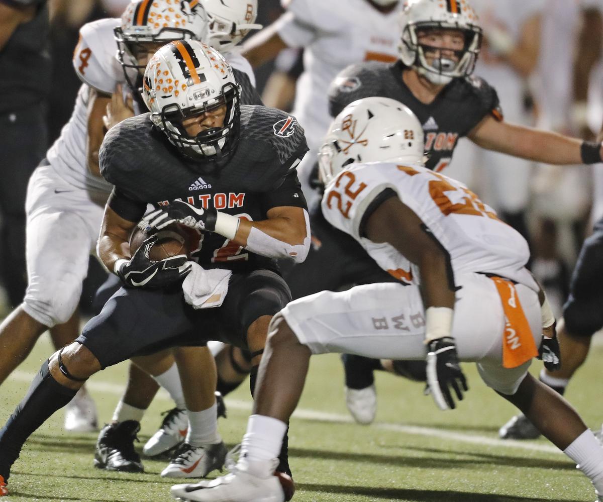 Bowie linebacker Tre Martin (22) zeros in on Haltom defensive back Johnny Smith-Rider (22) during the first half of a high school Bi-district football playoff game at Birdville FAAC in North Richland Hills, Texas, Thursday, Nov. 16, 2018. Bowie led 28-25 at the half. (Star-Telegram Bob Booth)
