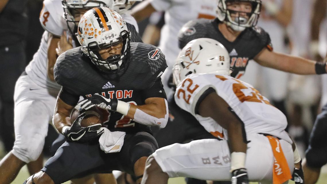 Bowie linebacker Tre Martin (22) zeros in on Haltom defensive back Johnny Smith-Rider (22) during the first half of a high school Bi-district football playoff game at Birdville FAAC in North Richland Hills, Texas, Thursday, Nov. 16, 2018. Bowie led 28-25 at the half. (Star-Telegram Bob Booth)

