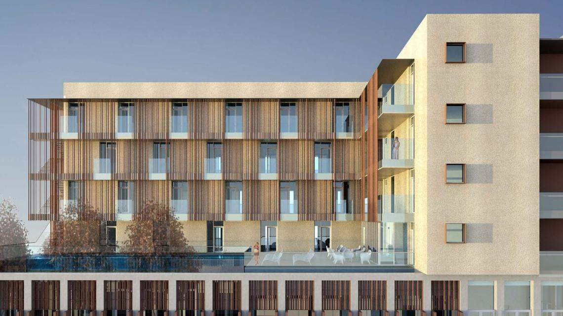 The project has gradually been revised from a four-story boutique hotel, to a three-story version, and now a two-story mixed use project. 