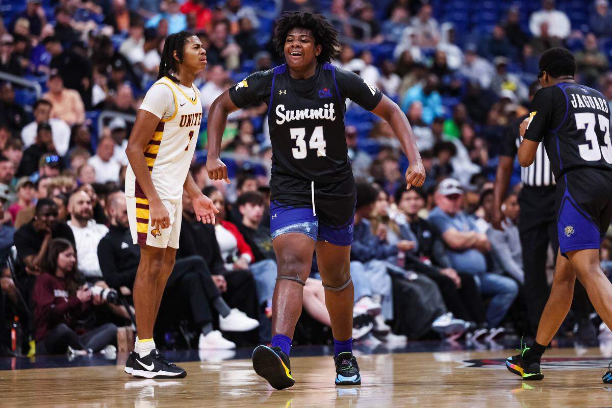 Mansfield Summit forward Emund Prichett II (34) screams in celebration while a Beaumont United player glares in confusion after committing an offensive foul during the Class 5A Division II state championship game Saturday at the Alamodome in San Antonio.