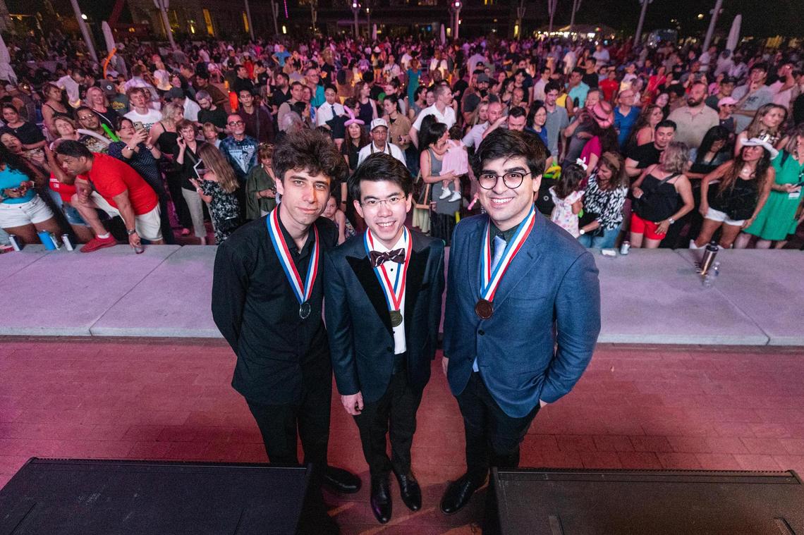 Silver medalist Vitaly Starikov, left, Gold medalist Aristo Sham, middle, and bronze medalist Evren Ozel, right, are photographed on stage following the Van Cliburn International Piano Competition Awards Ceremony at Sundance Square in Fort Worth on Saturday, June 7, 2025.