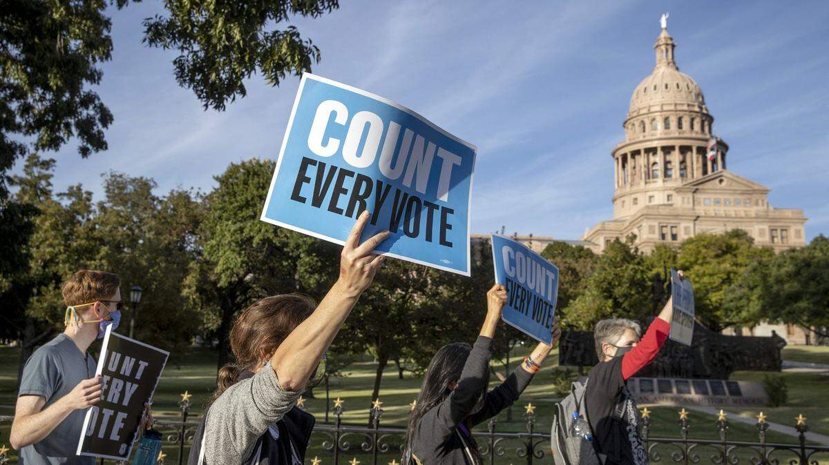 Protesters march in front of the Capitol in Austin, Texas, on Wednesday November 4, 2020, to demand all votes in the general election be counted.