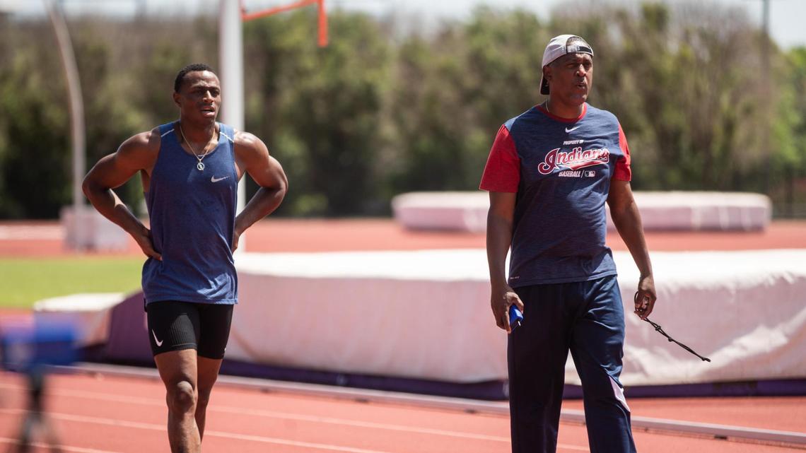 TCU track and field coach Darryl Anderson, right, who still coaches TCU alumnus Ronnie Baker professionally, was fired after 18 seasons on Friday.