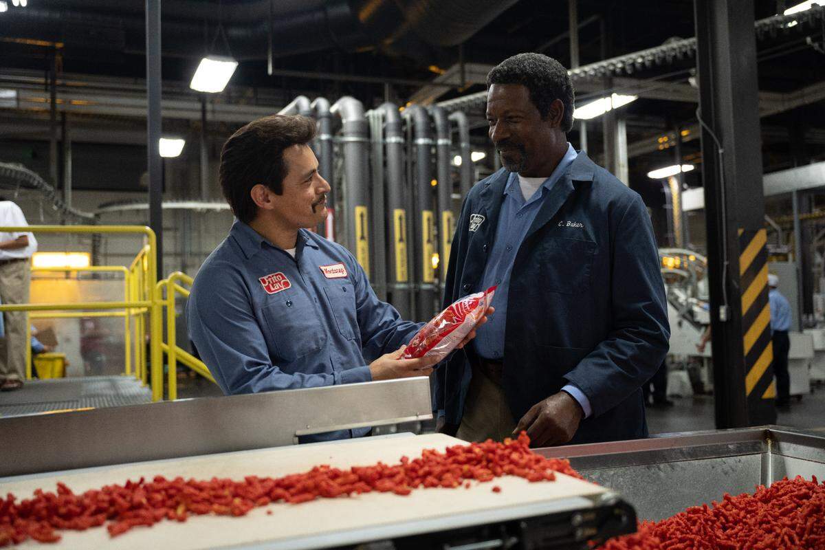 Jesse Garcia and Dennis Haysbert in FLAMIN’ HOT. Photo by Anna Kooris. Courtesy of Searchlight Pictures. © 2023 20th Century Studios All Rights Reserved.