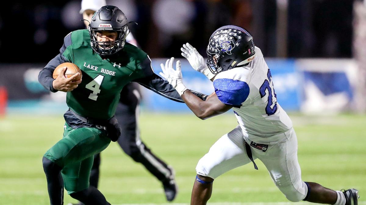 Mansfield Lake Ridge quarterback Chandler Rogers (4) tries to elude Mansfield Summit linebacker David Cottrell (22) during the first half, Friday night, November 9, 2018 played at Newsom Stadium in Mansfield, TX