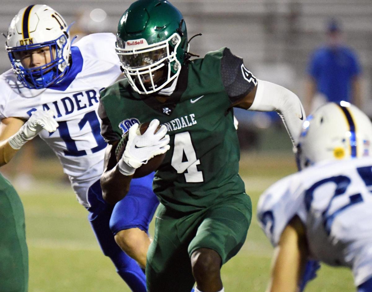 Kennedale’s Ife Adeyemi,center races between Sunnyvale’s Gage Andrews, left and Hudson Smith for first down yards in the second quarterof their football game Friday, September 11, 2020 in Kennedale, Texas. Special/Bob Haynes