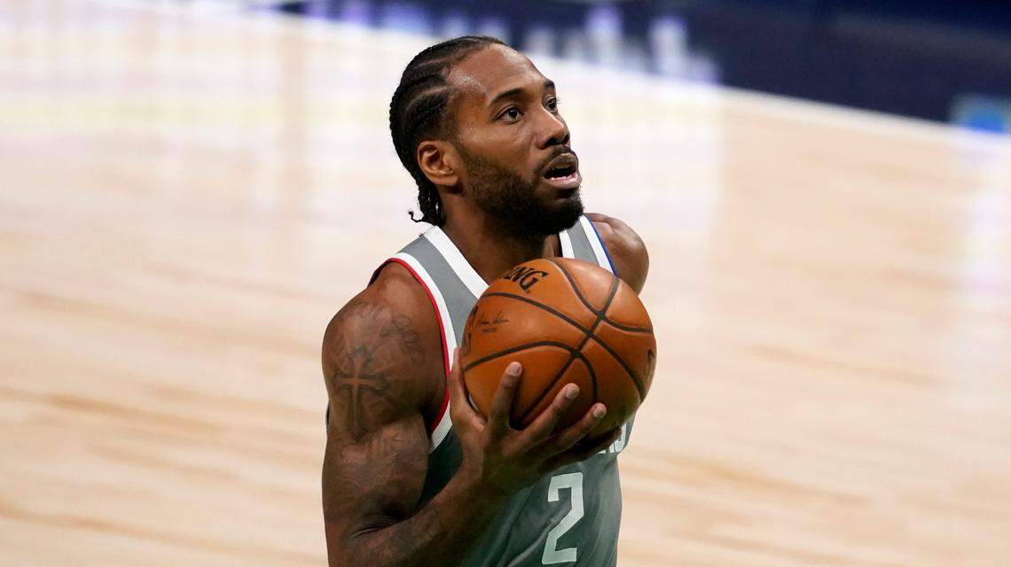 Los Angeles Clippers’ Kawhi Leonard breaks to the basket for a shot during an NBA basketball game against the Dallas Mavericks in Dallas, Wednesday, March 17, 2021.