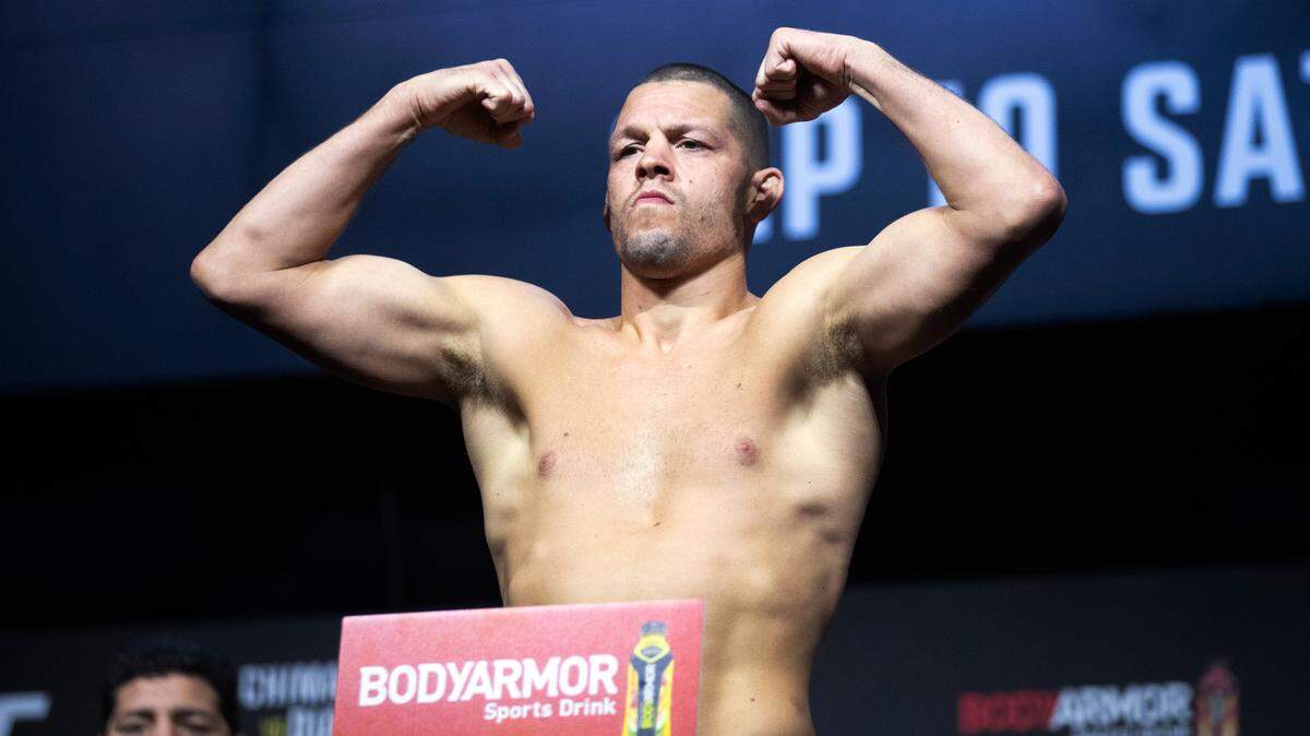 Welterweight fighter Nate Diaz poses on the scale during a ceremonial weigh-in for the UFC 279 mixed martial arts event on Sept. 9, 2022, in Las Vegas. YouTube sensation Jake Paul will take on former UFC veteran Diaz in a boxing match on Aug. 5, 2023, in Dallas..