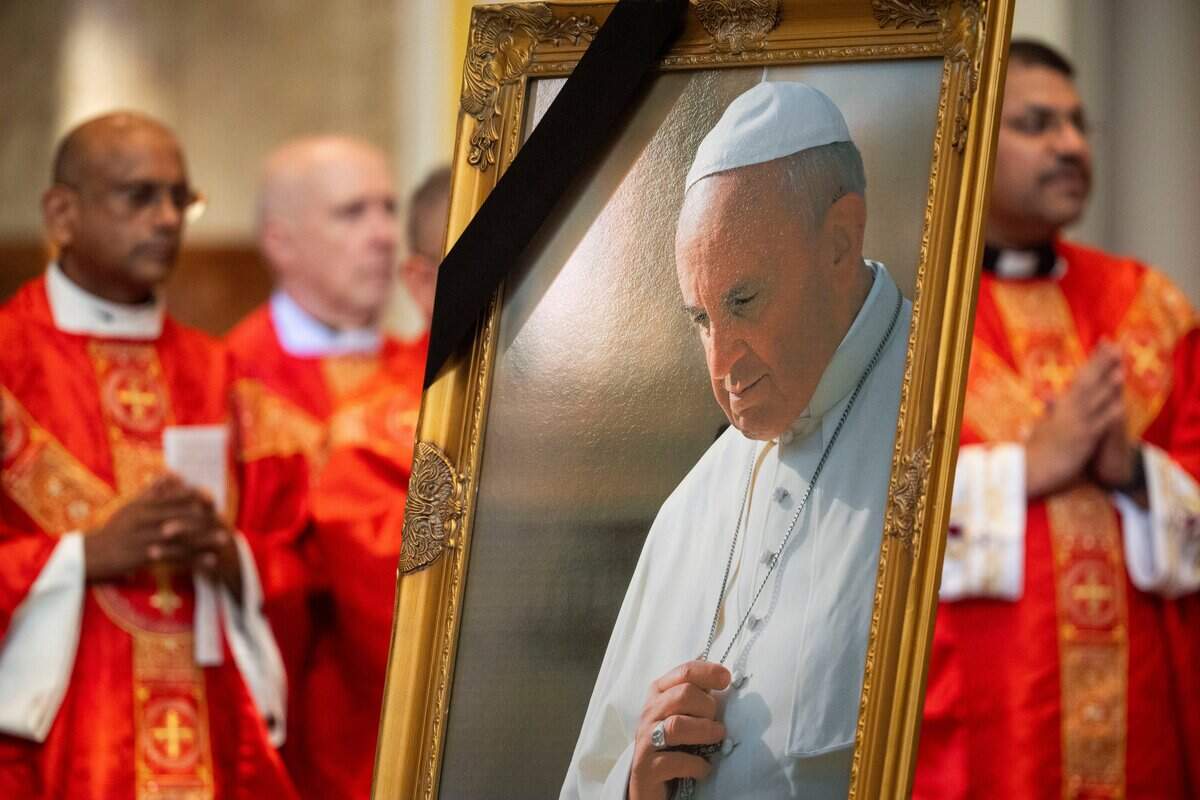 A photo of Pope Francis is displayed during an official diocesan memorial Mass for Pope Francis at Cathedral of the Incarnation in Nashville, Tenn., Monday, April 28, 2025.