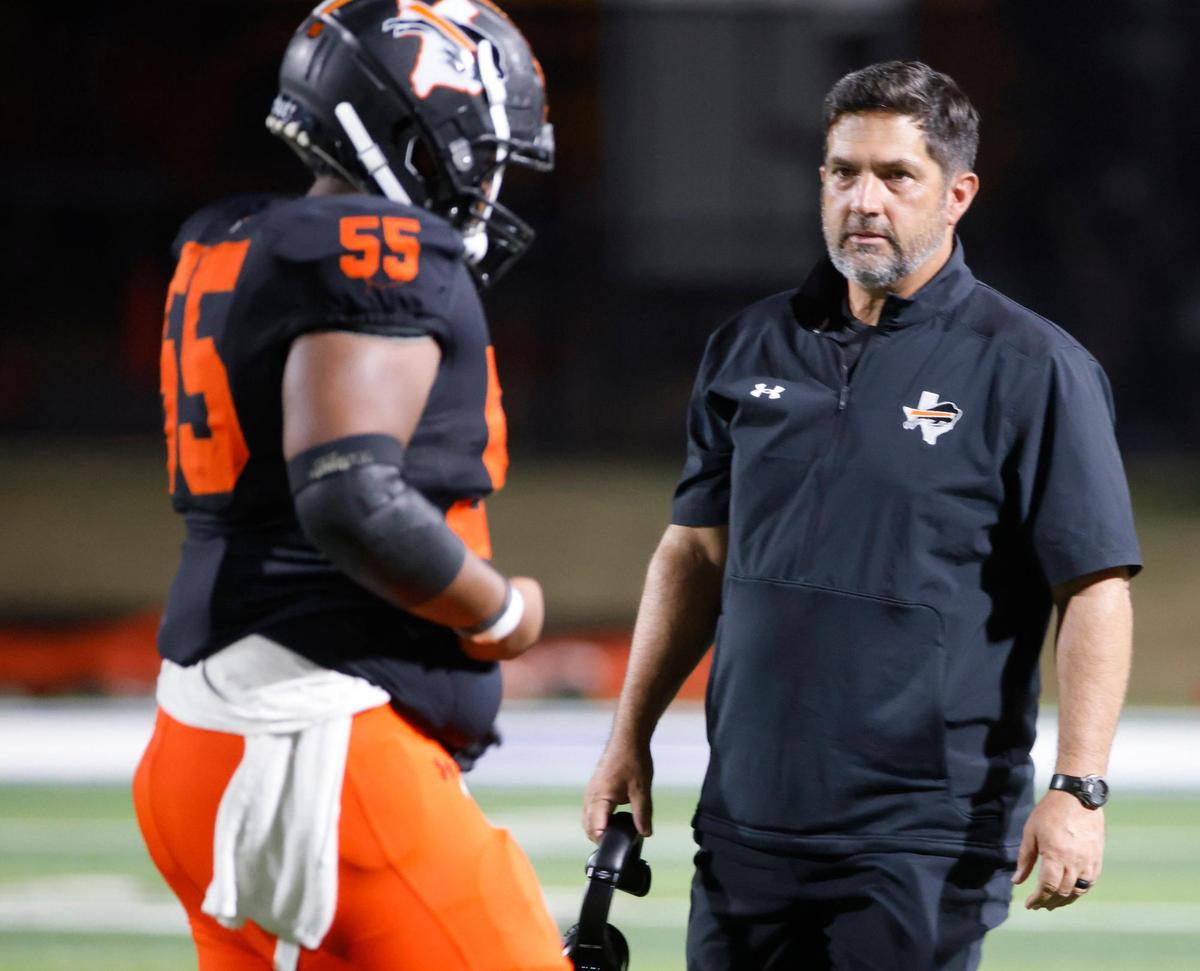 Haltom head coach Jason Tucker glances down field as players exit to the sidelines during a District 8-6A football game at Birdville Fine Arts/Activity Complex in North Richland Hills, Texas, Friday, Oct. 25, 2024.