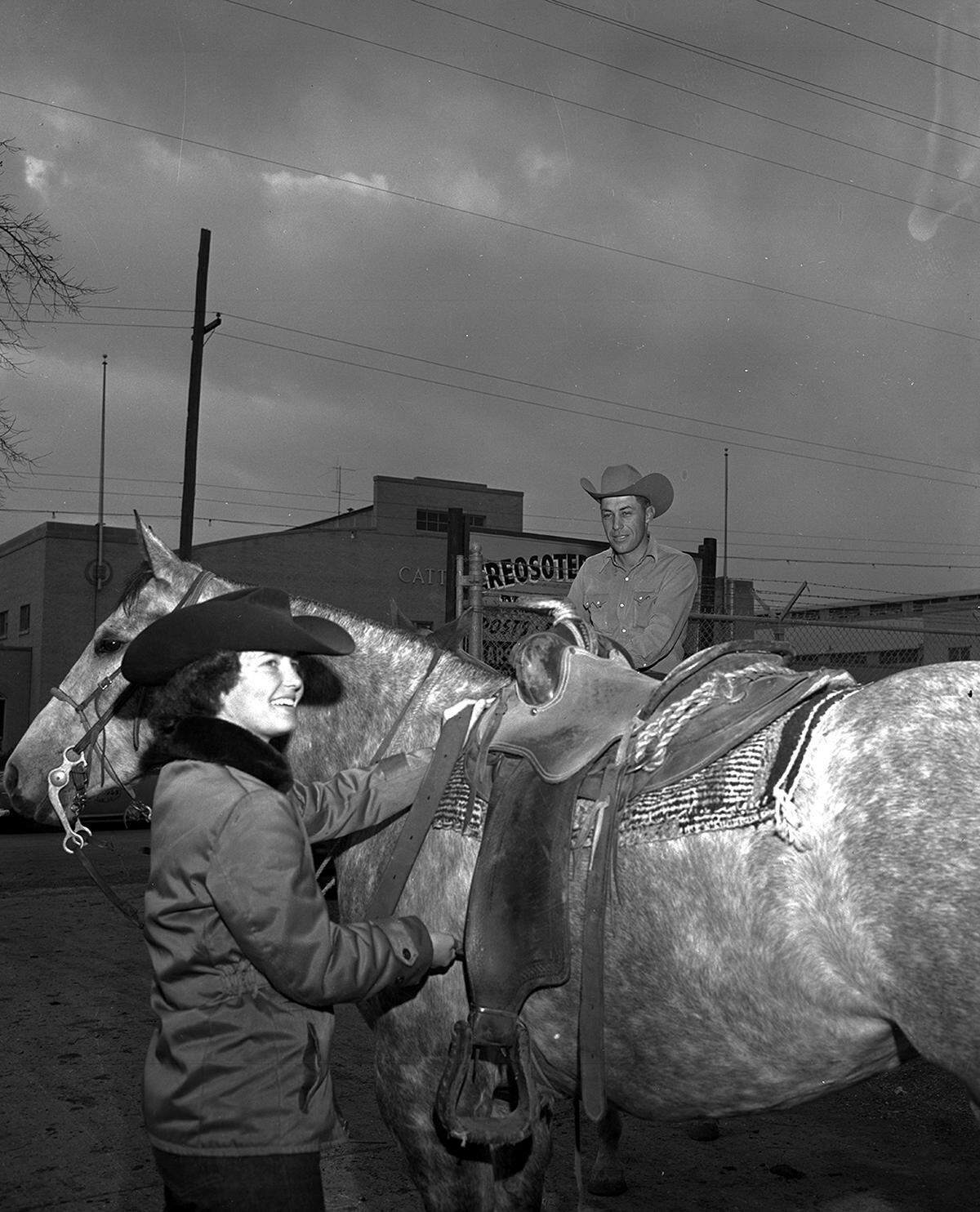 Jan. 30, 1953: “Mrs. Willard Davis of Crosbyton tightens the cinch on her horse as she prepares to mount and take part in Friday’s downtown stock show parade. Her husband looks on approvingly.”