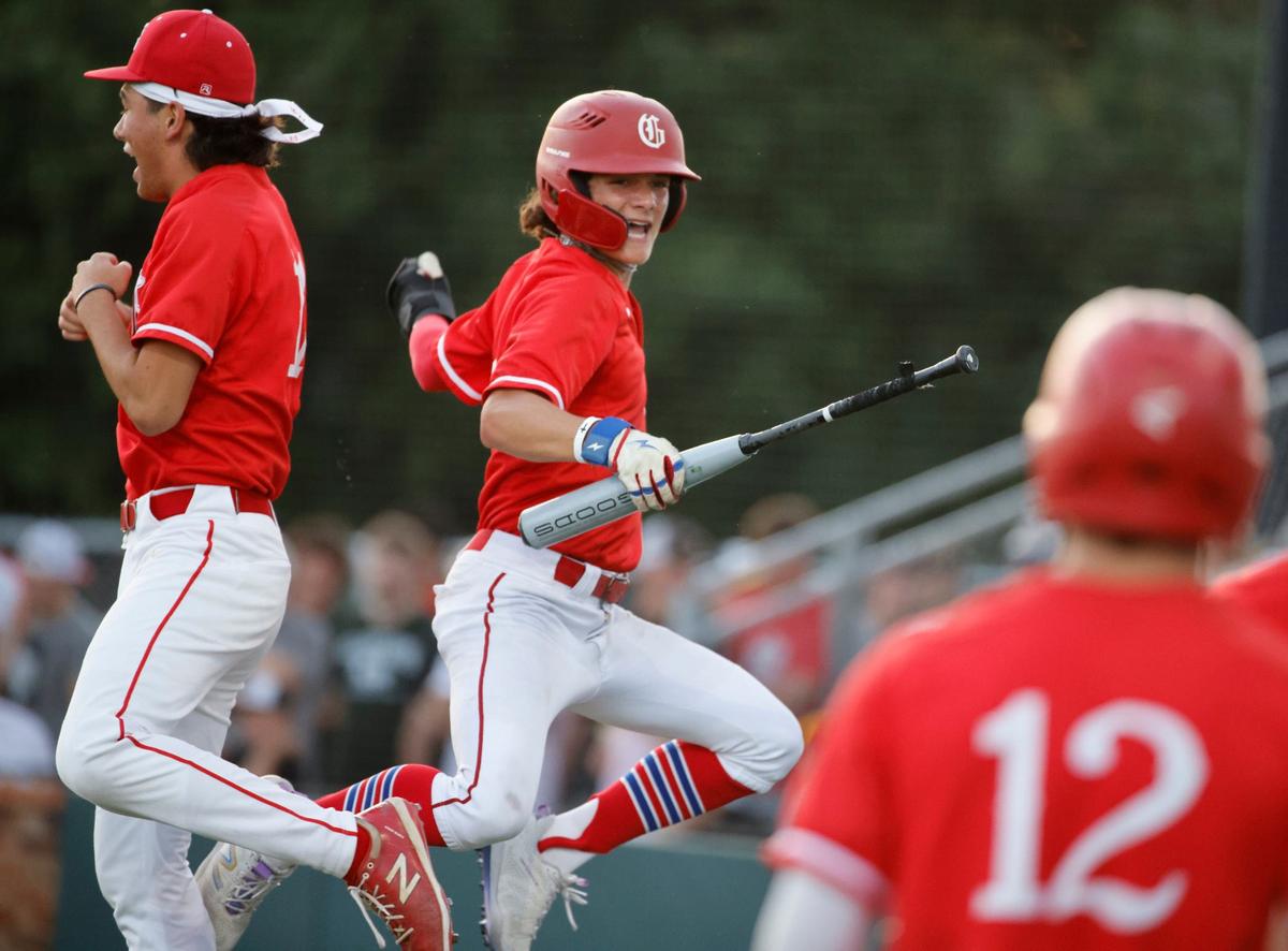 Grapevine pitcher JoJo Kubo and Zach Goldstein celebrate Goldstein’s run during game 2 of a UIL Conference 5A Regional final baseball game at Nathan F. Sanford Field at L.D. Bell in Hurst, Texas, Friday May 31, 2024.