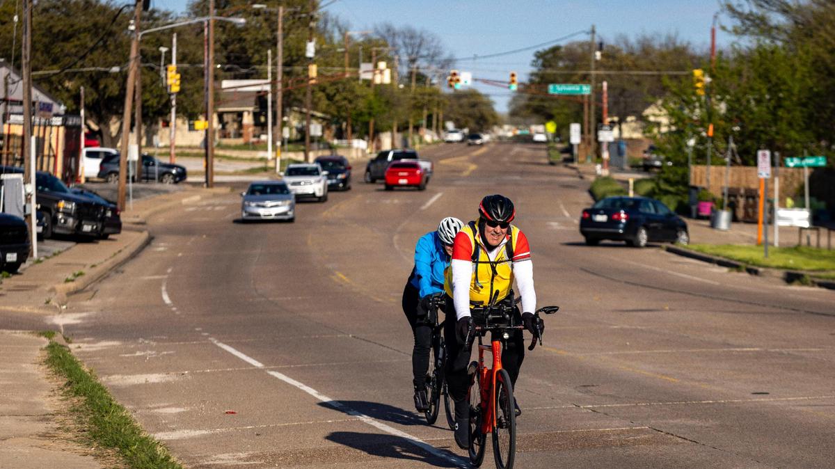 Cyclists ride down East Fourth Street near the South Sylvania Avenue - a popular cycling route that Fort Worth plans to fortify with a bike lane.
