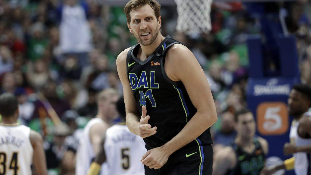 Dallas Mavericks center Dirk Nowitzki celebrates sinking a 3-point basket during a game in March.