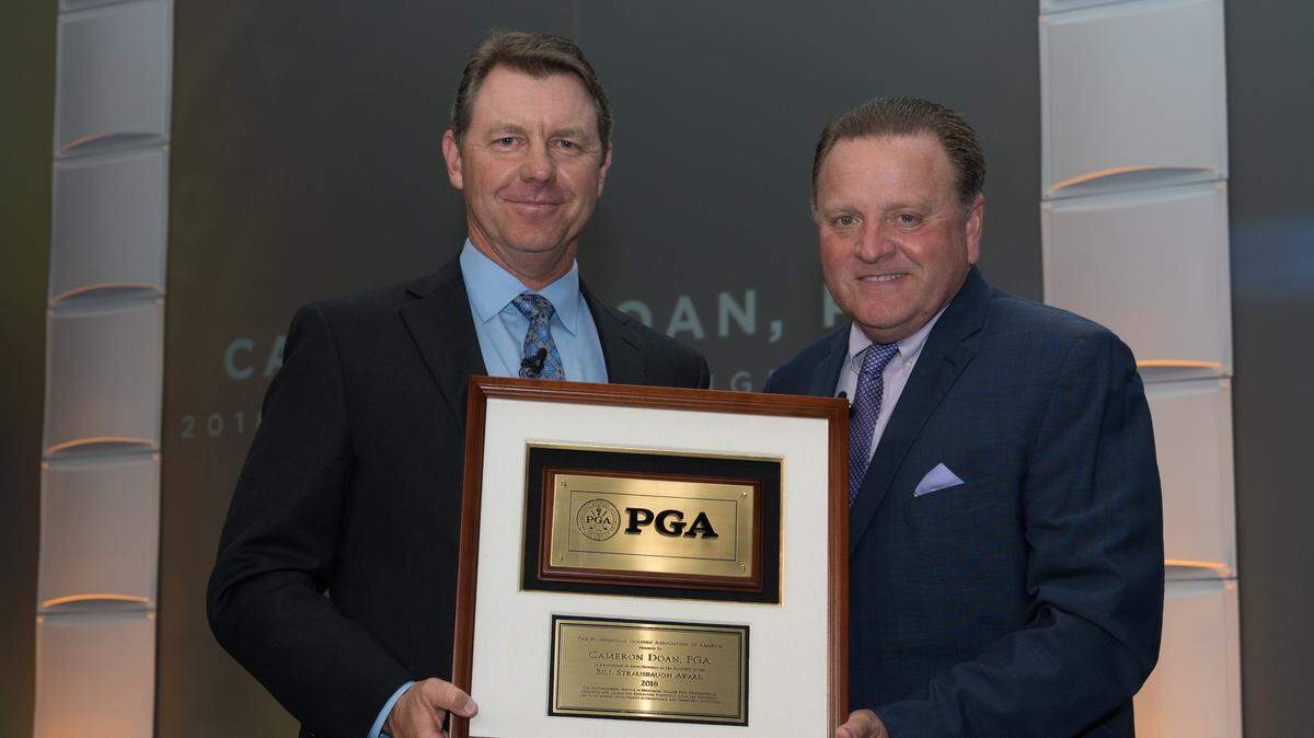 INDIAN WELLS, CALIFORNIA - NOVEMBER 6: Cameron Doan, Bill Strausbaugh Award winner with PGA of America President, Paul Levy during the PGA Awards Dinner at the 102nd PGA Annual Meeting at the Renaissance Indian Wells Resort & Spa on November 6, 2018 in Indian Wells, California. (Photo by Darren Carroll/PGA of America)