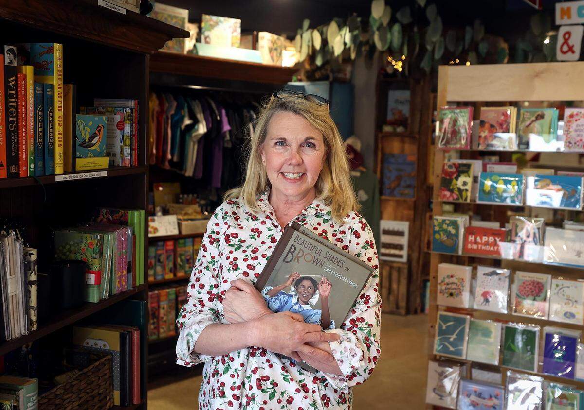 Shelley Lowee, owner Monkey and Dog bookstore in Fort Worth, stands inside her shop on Thursday. Lower will be having sales and local authors on site Saturday for Independent Bookstore Day.