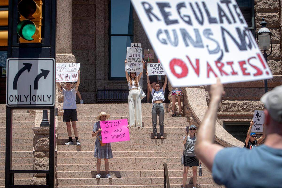 Abortion-rights advocates line the steps of the Tarrant County Courthouse after a march downtown in June 2022. Hundreds gathered with a rallying cry of “My body, my choice” after Roe v. Wade was overturned the day before.