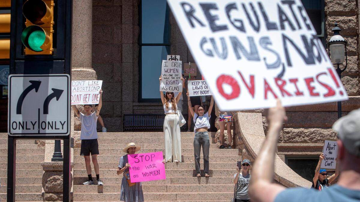Abortion-rights advocates line the steps of the Tarrant County Courthouse after a march downtown on Saturday, June 25. Hundreds gathered with a rallying cry of “My body, my choice” after Roe v. Wade was overturned the day before.