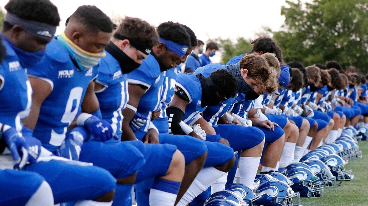 The entire Nolan Catholic football team took a knee for a pre game prayer before a high school football game at Doskocil Stadium in Fort Worth, Texas, Friday, Oct. 02, 2020. Nolan Catholic defeated Midland Christian 38-21. (Special to the Star-Telegram Bob Booth)