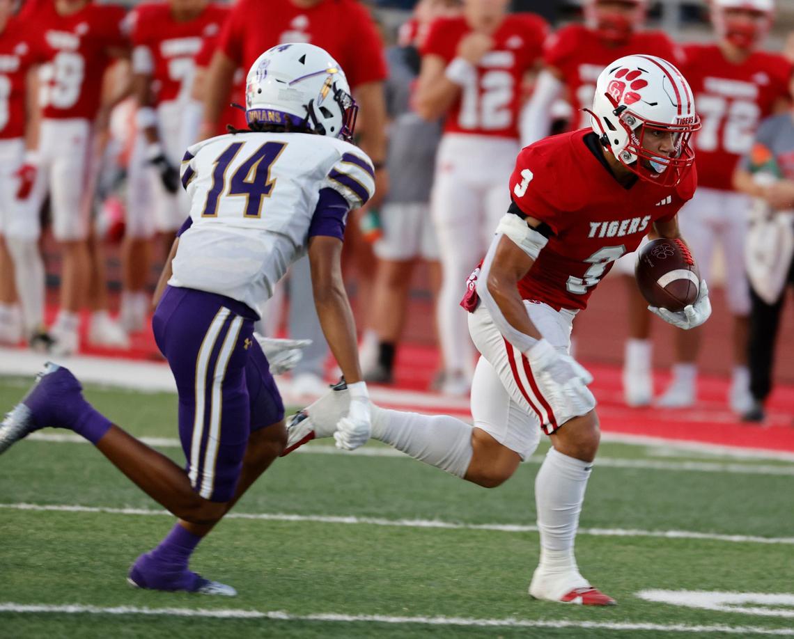 Glen Rose wide receiver Josiah Groeneweg (3) takes off chased by Alvarado defensive back Javion Johnson (14) during a UIL football game at Tiger Stadium in Glen Rose Texas, Friday, Sept. 27, 2024.