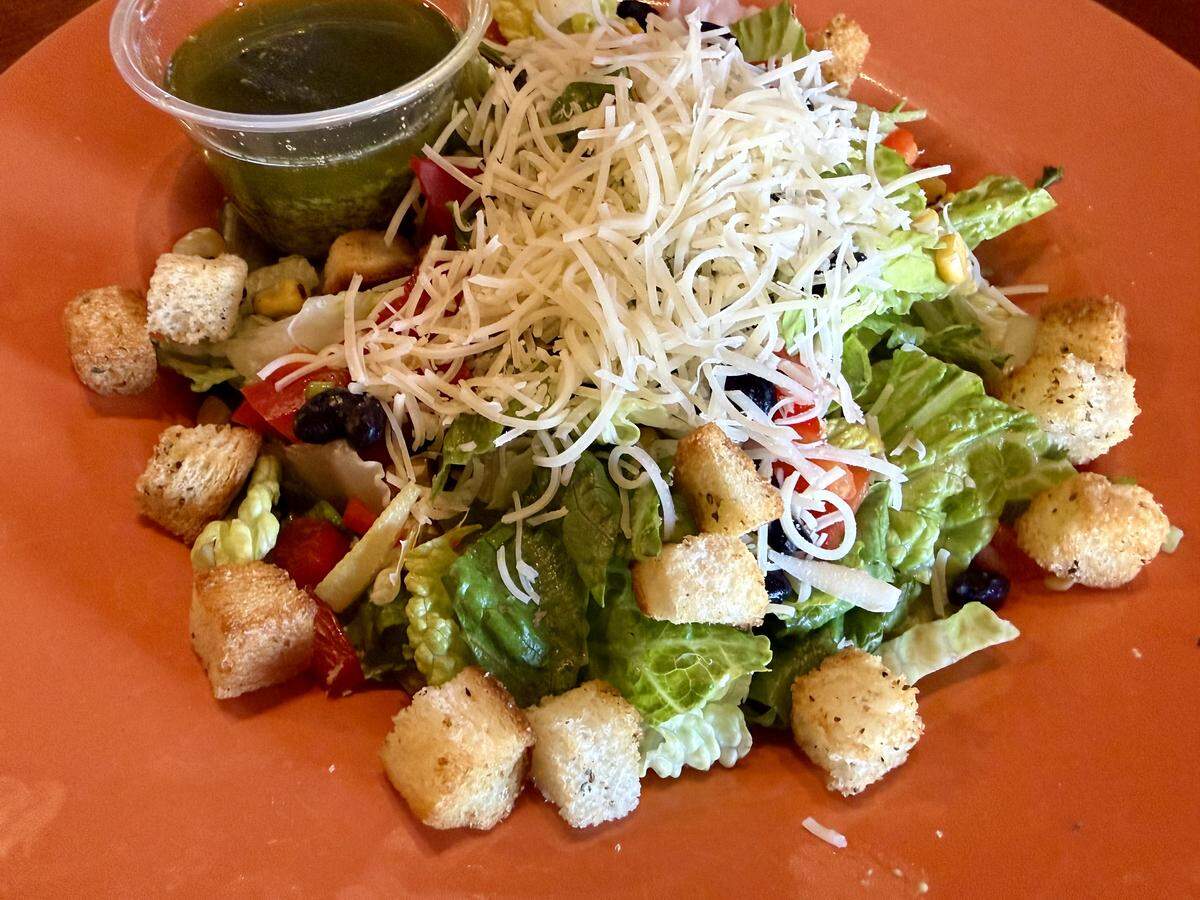 A “Texas Caesar” salad adds sweet red peppers, charred corn, black beans and cilantro dressing to traditional Caesar toppings at Shaw’s Southwest Grille in Granbury, Texas.