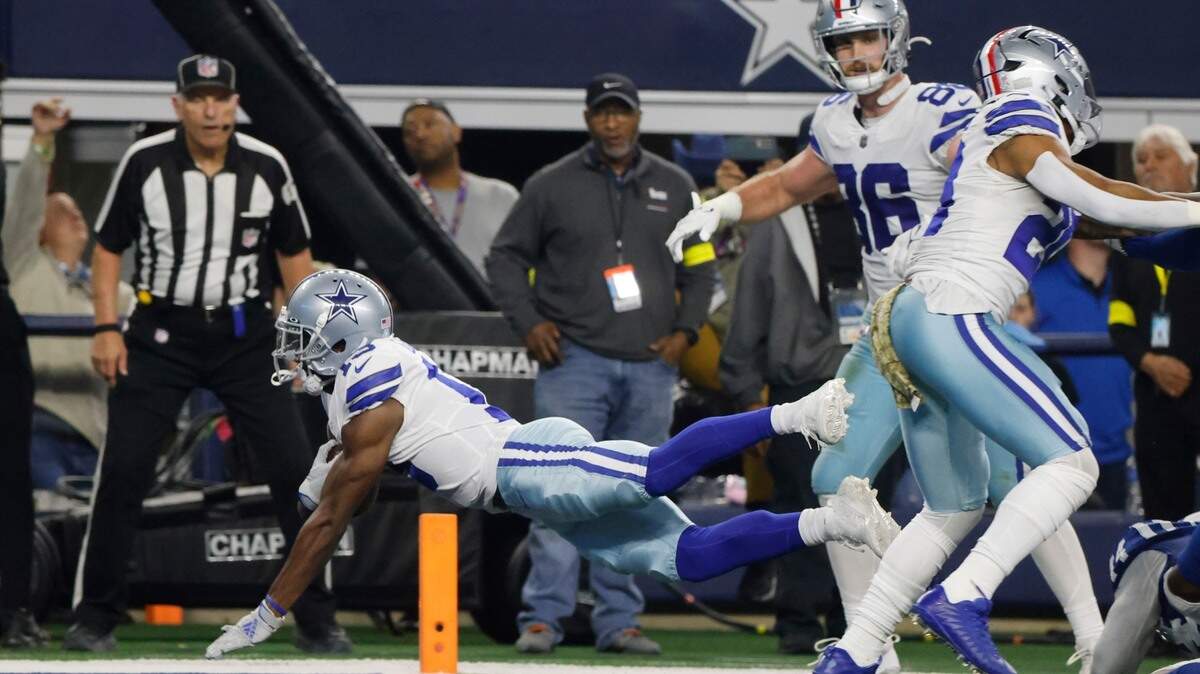 Dallas Cowboys’ Michael Gallup (13) dives in for a touchdown during the first half of an NFL football game against the Indianapolis Colts, Sunday, Dec. 4, 2022, in Arlington, Texas. (AP Photo/Michael Ainsworth)