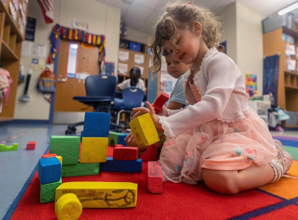 Ella Calloway smiles as she places a foam block down during a pre-K prep program at Castleberry Elementary School in Fort Worth on June 29, 2026. Calloway was tasked with builidng an aquarium for a shark plushie.