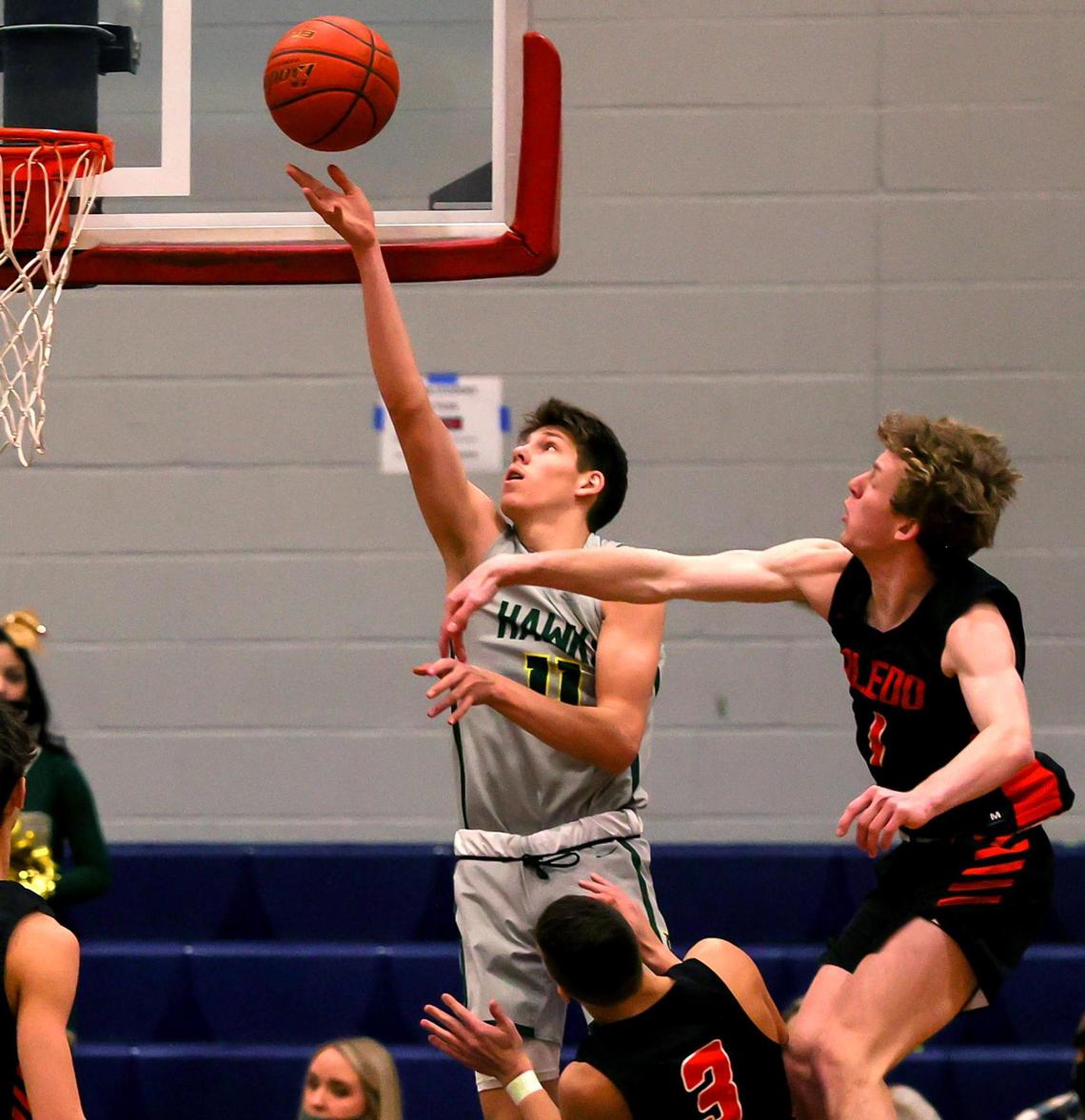 Birdville guard Gehrig Normand (11) drives past Aledo guard Clark Crawford (1) for two-points during the first half of a 5A Bi-district Boys High School Basketball game played at Richland High School, February 20, 2021 in North Richland Hills, Tx. (Steve Nurenberg Special to the Star-Telegram)
