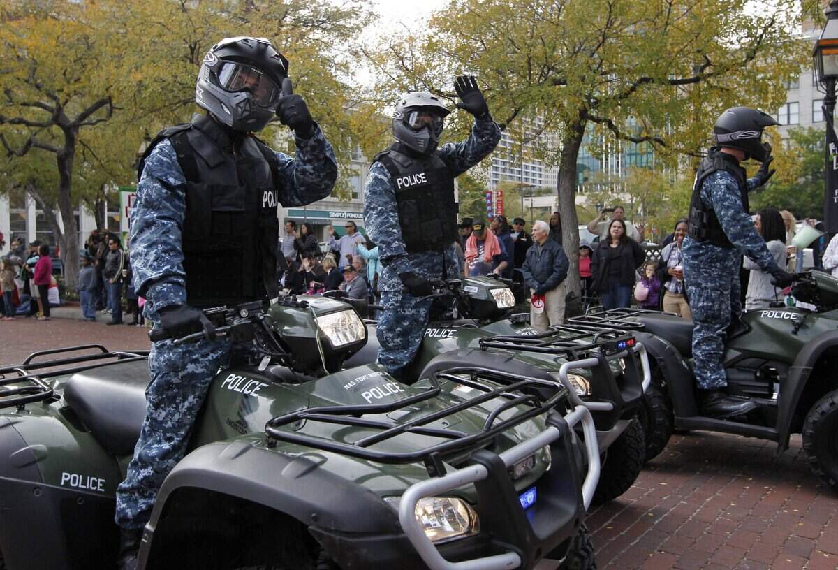 Nov. 12, 2011: Military Police on ATVs from Naval Air Station Joint Reserve Base Fort Worth wave to crowds in the annual Veterans Day parade in downtown.