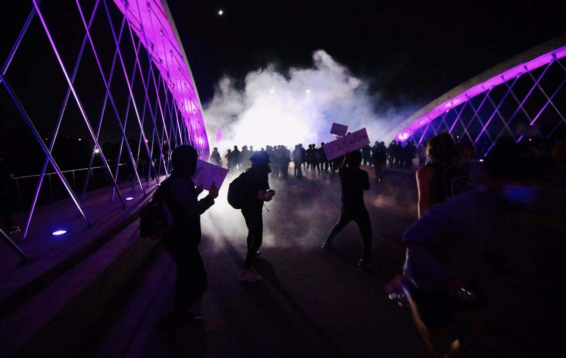 Fort Worth police began using tear gas to disperse protesters from the 7th Street bridge after a crowd had been in a standoff with officers there for about three hours Sunday night.