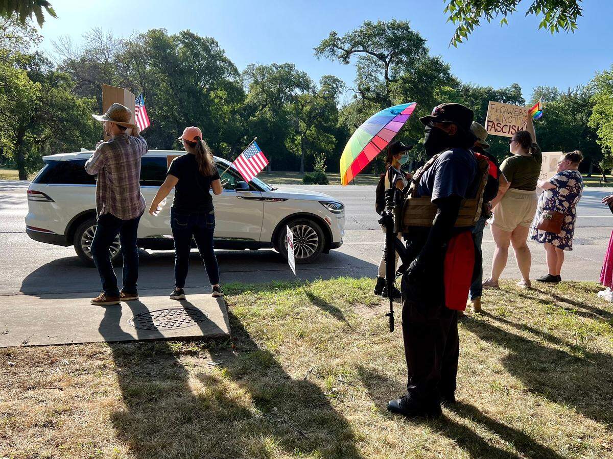 An armed protester outside the Fort Worth Botanic Garden, protesting True Texas Project’s birthday party and conference Saturday July 13, 2024