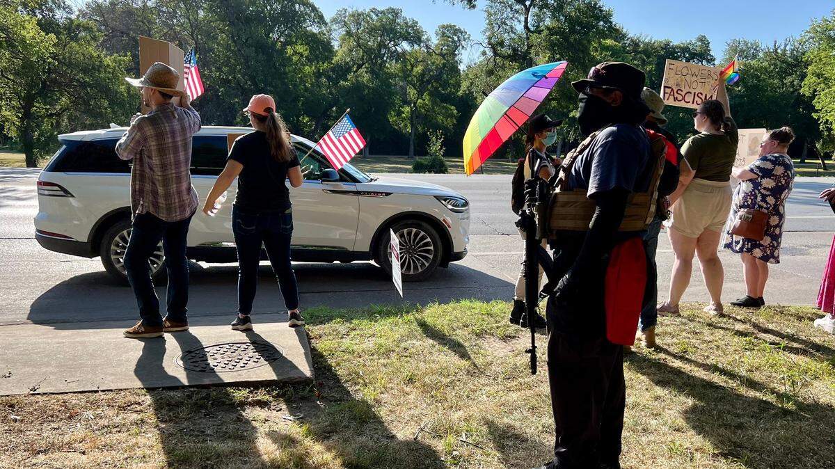 An armed protester outside the Fort Worth Botanic Garden, protesting True Texas Project’s birthday party and conference Saturday July 13, 2024