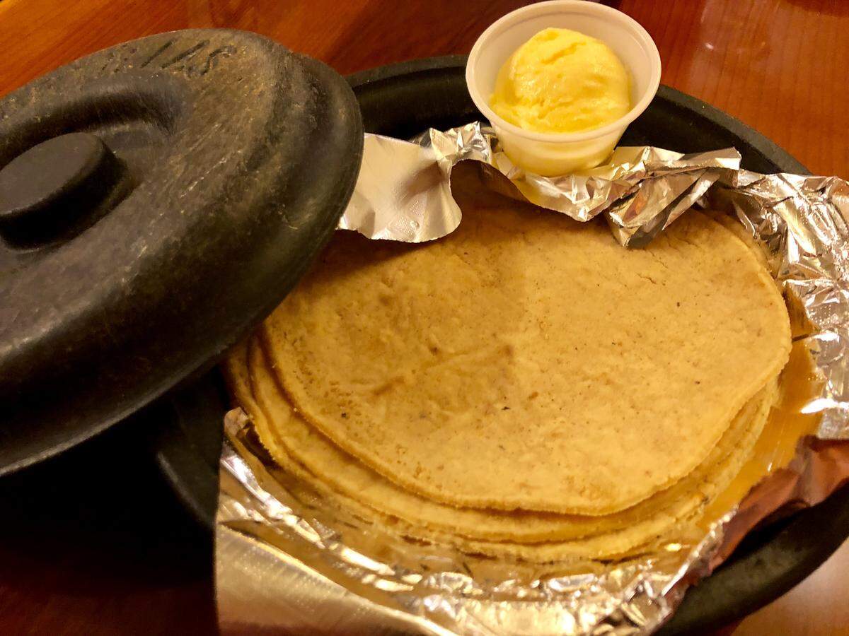 A helping of housemade corn or flour tortillas comes with butter at Fiesta Mexican Restaurant.