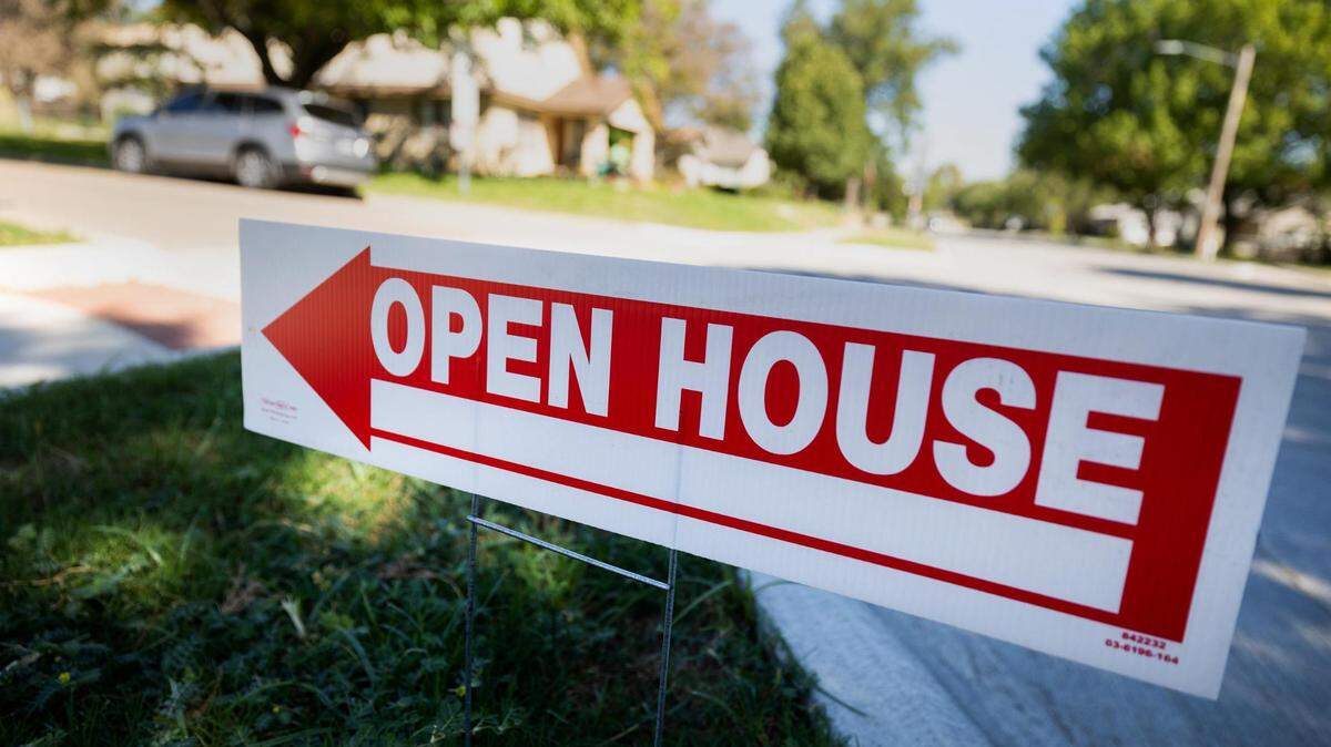An open house sign directs to a house for sale in the Arlington Heights neighborhood in Fort Worth.