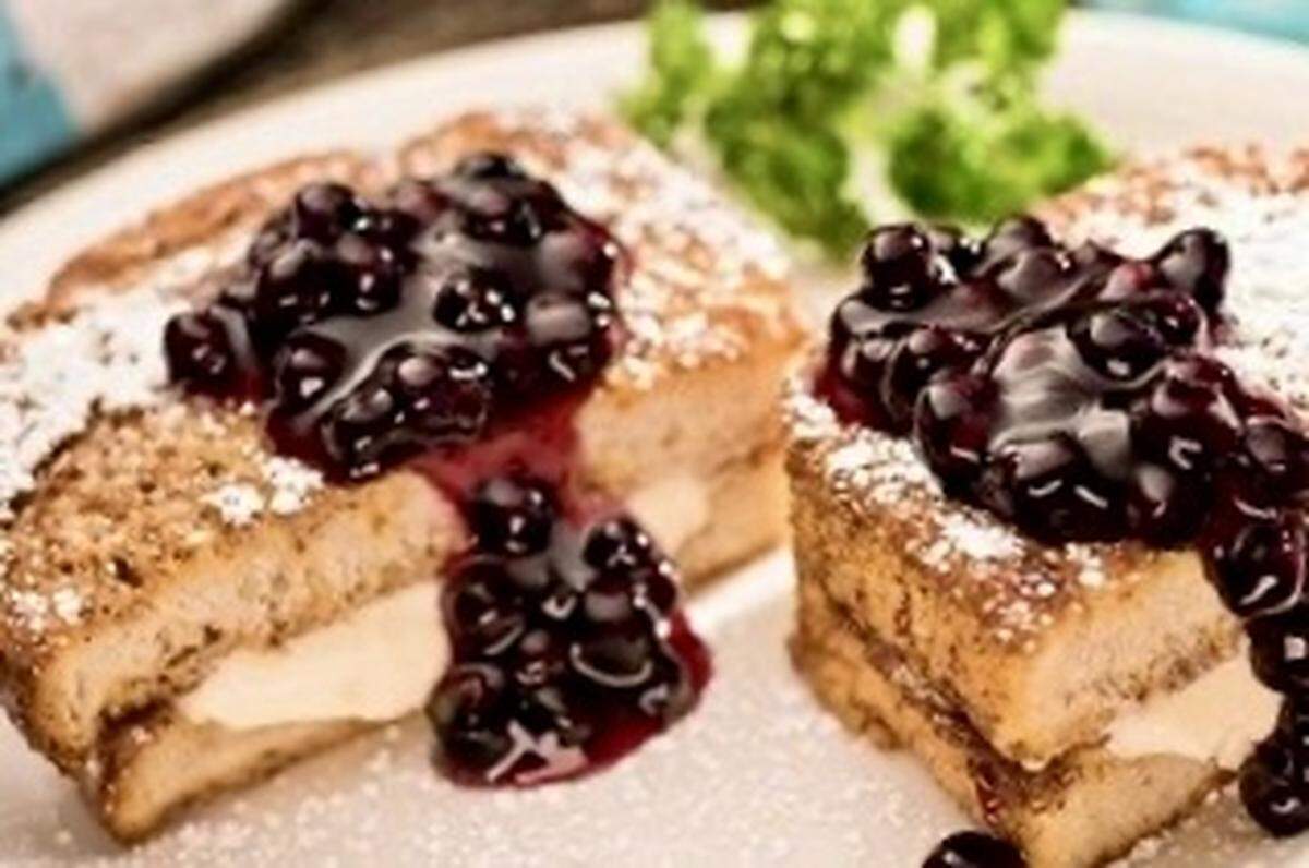 Stuffed French toast with a vanilla cream filling and a huckleberry compote at Huckleberry’s breakfast and lunch restaurants.