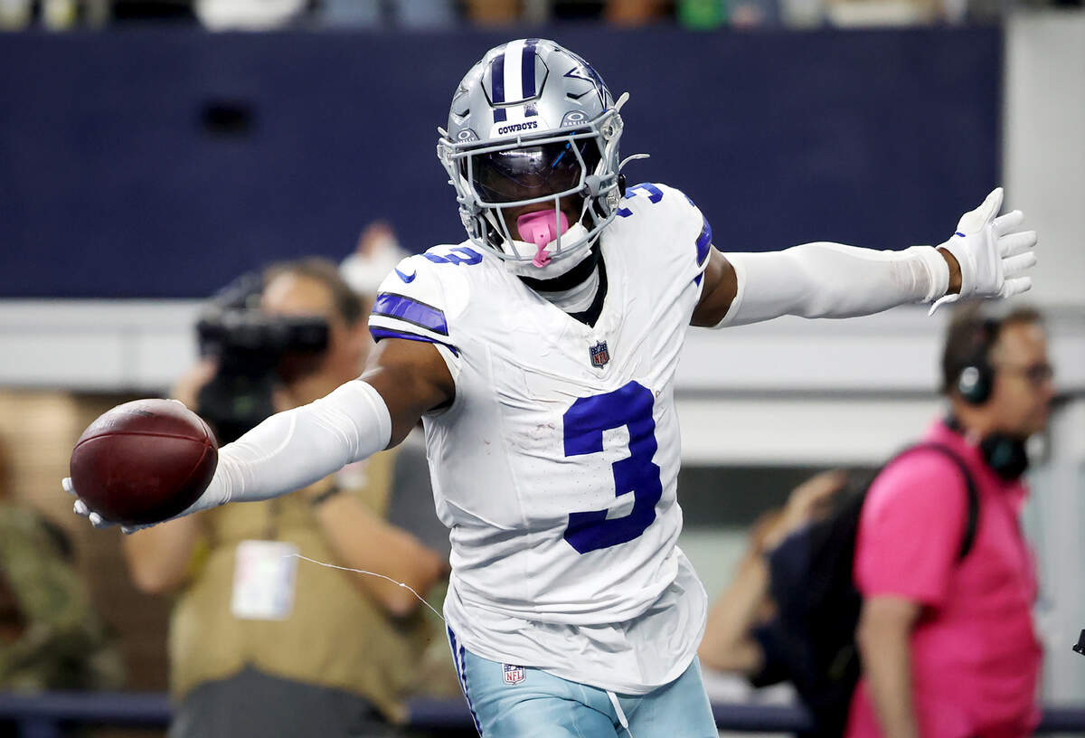 Dallas Cowboys wide receiver George Pickens celebrates after one of his touchdowns against the Green Bay Packers on Sunday at AT&T Stadium in Arlington.