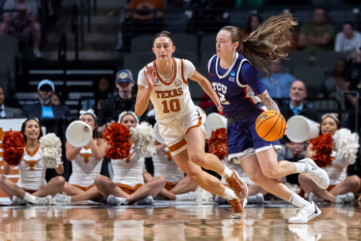 Texas Longhorns guard Shay Holle (10) defends against TCU Horned Frogs guard Madison Conner (2) during the first half of an Elite 8 NCAA Tournament basketball game at Legacy Arena.
