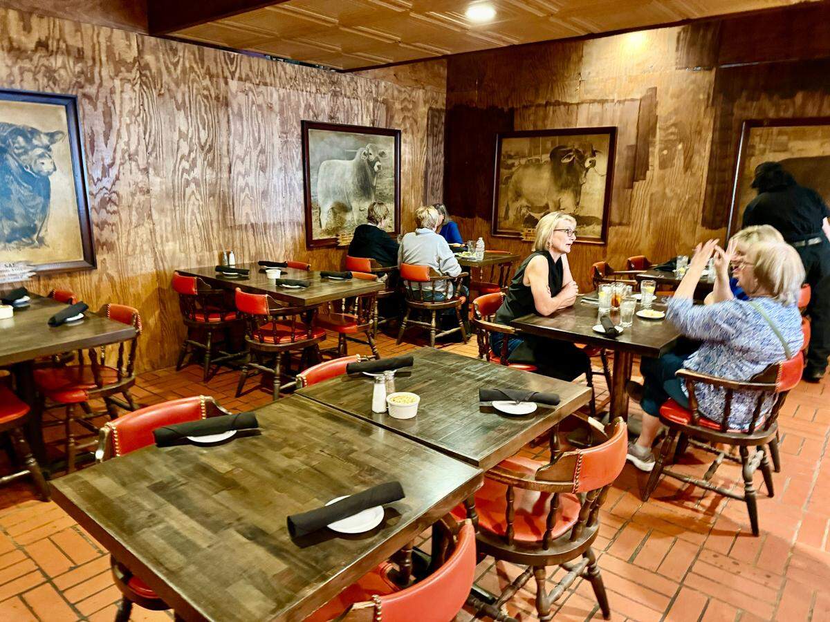 The old main dining room at Cattlemen’s Fort Worth Steak House is still under remodeling but kept the photos of past Stock Show winners, seen in Fort Worth Oct. 19, 2024.