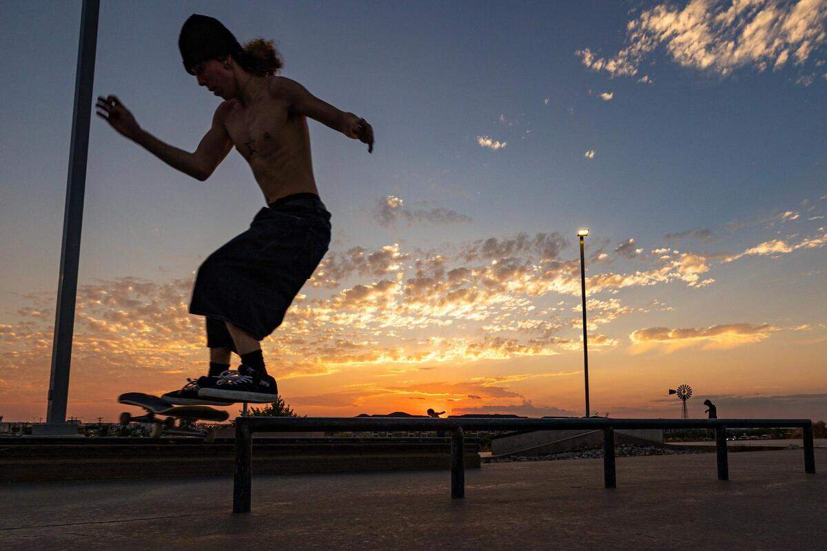 Jay Jones balances on a rail at sunset at Chisholm Trail Skate Park in Fort Worth on Tuesday, Aug. 29, 2023.