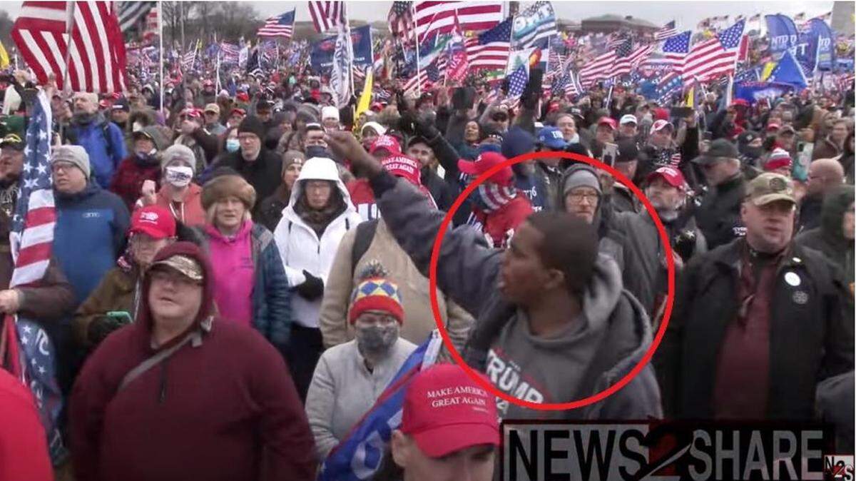 Philip Anderson, circled in red, raises his arms as he chants “Stop the Steal” while demonstrating on the National Mall in response to former President Trump’s speech on Jan. 6, 2021, according to the Department of Justice.