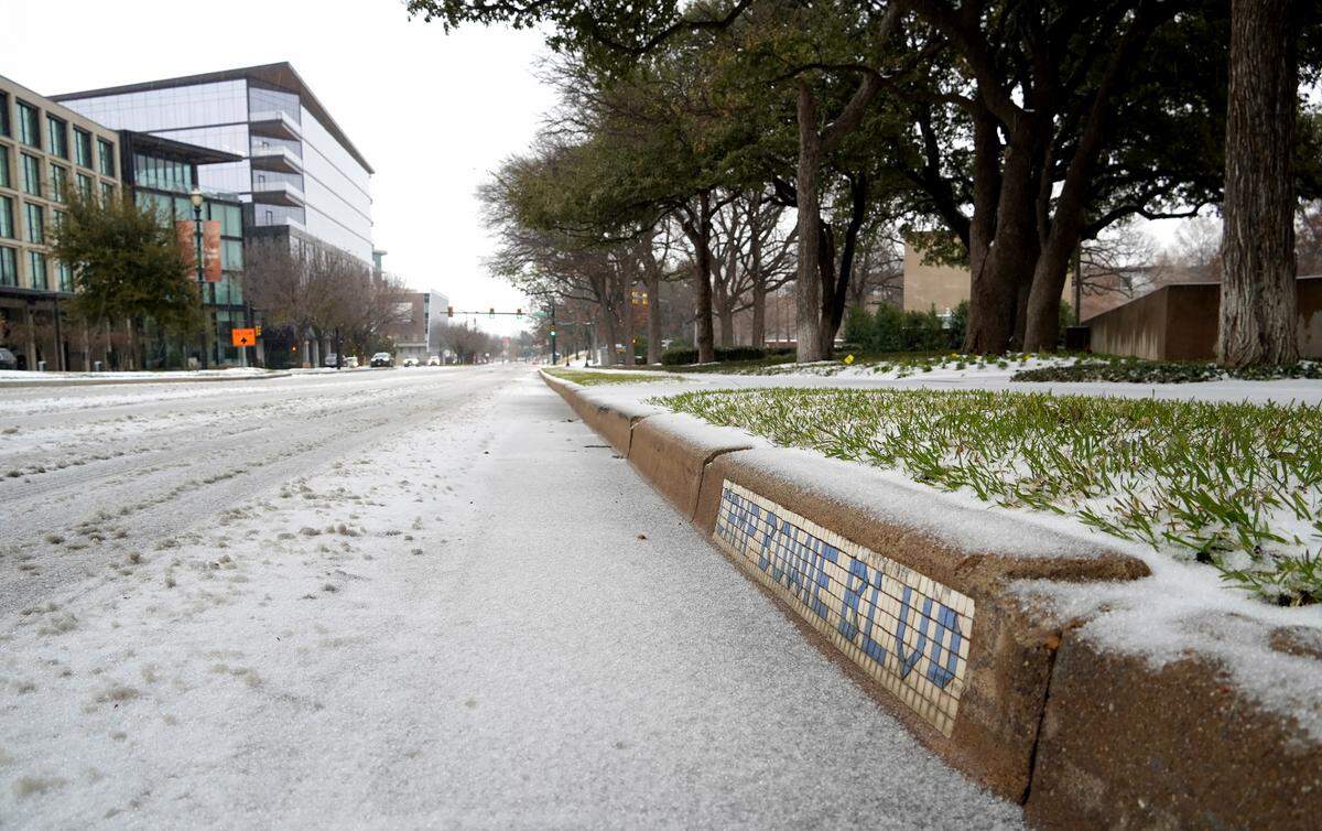 A layer of snow and sleet on Camp Bowie Boulevard in Fort Worth on Thursday, Jan. 9, 2025.