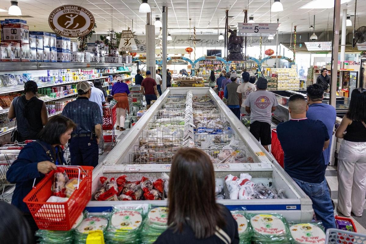 Long lines form at the cash registers at Nguyen Loi Oriental Supermarket on East Belknap Street. The store is one of the biggest and longest-running Asian supermarkets in the city.