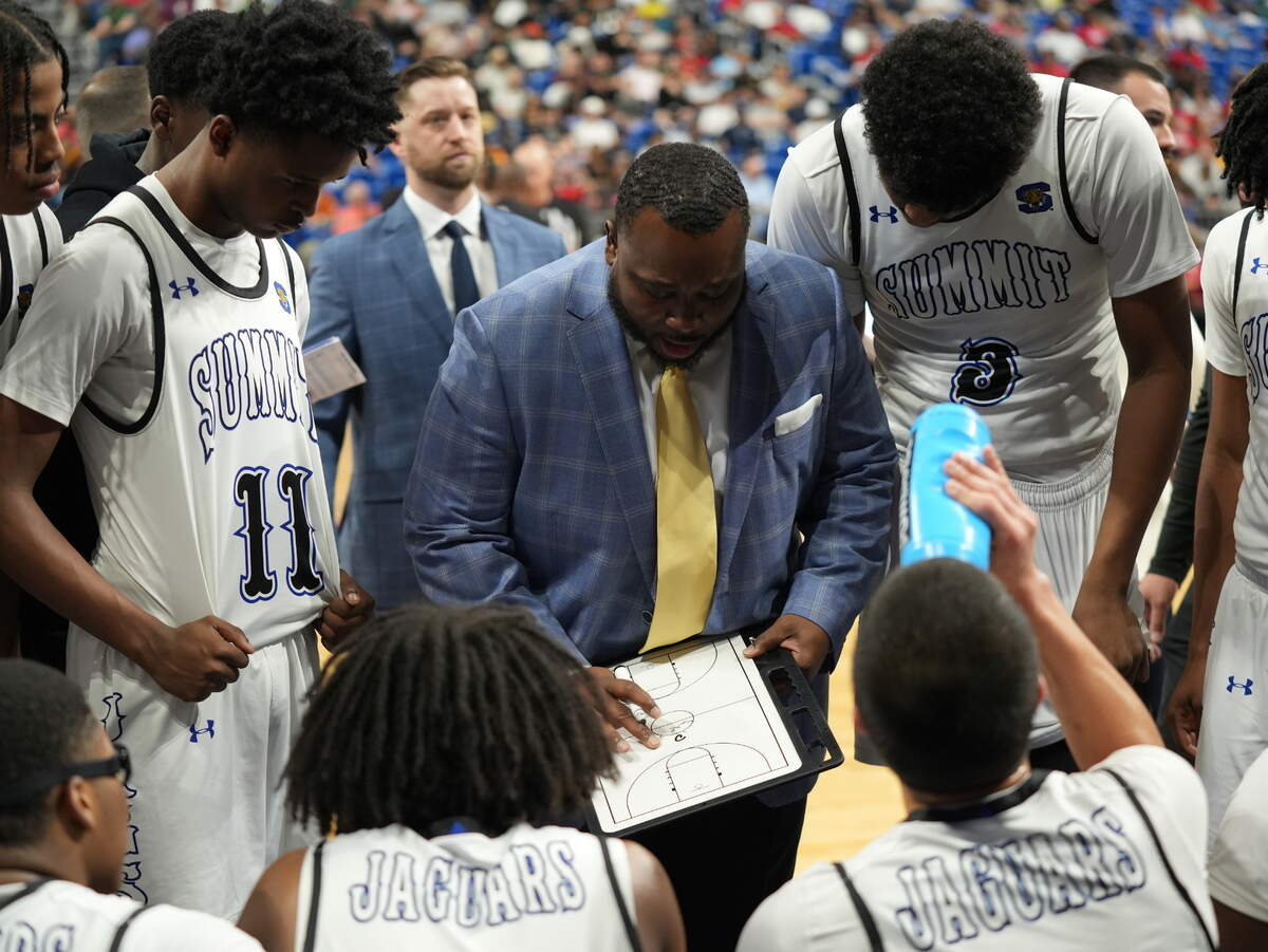 Mansfield Summit head coach Emund Prichett draws up a play against Missouri City Marshall in the Class 5A Division 2 state championship game on Saturday, March 8, 2025 at the Alamodome in San Antonio, Texas. Summit defeated Marshall 54-47.