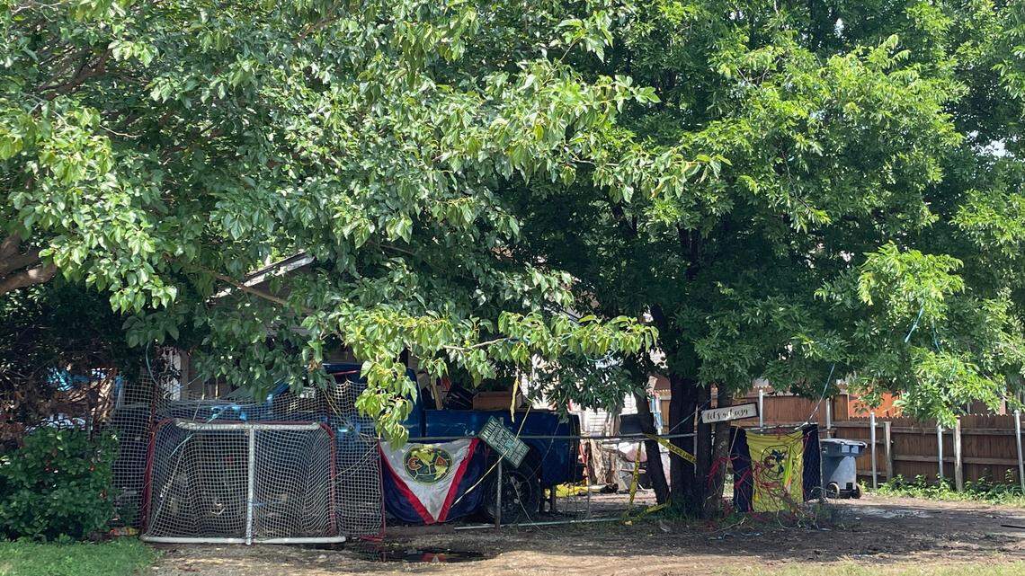 Crime-scene tape outside a Fort Worth home where a father and his adult son were killed in a shooting early Tuesday morning, June 4, 2024.