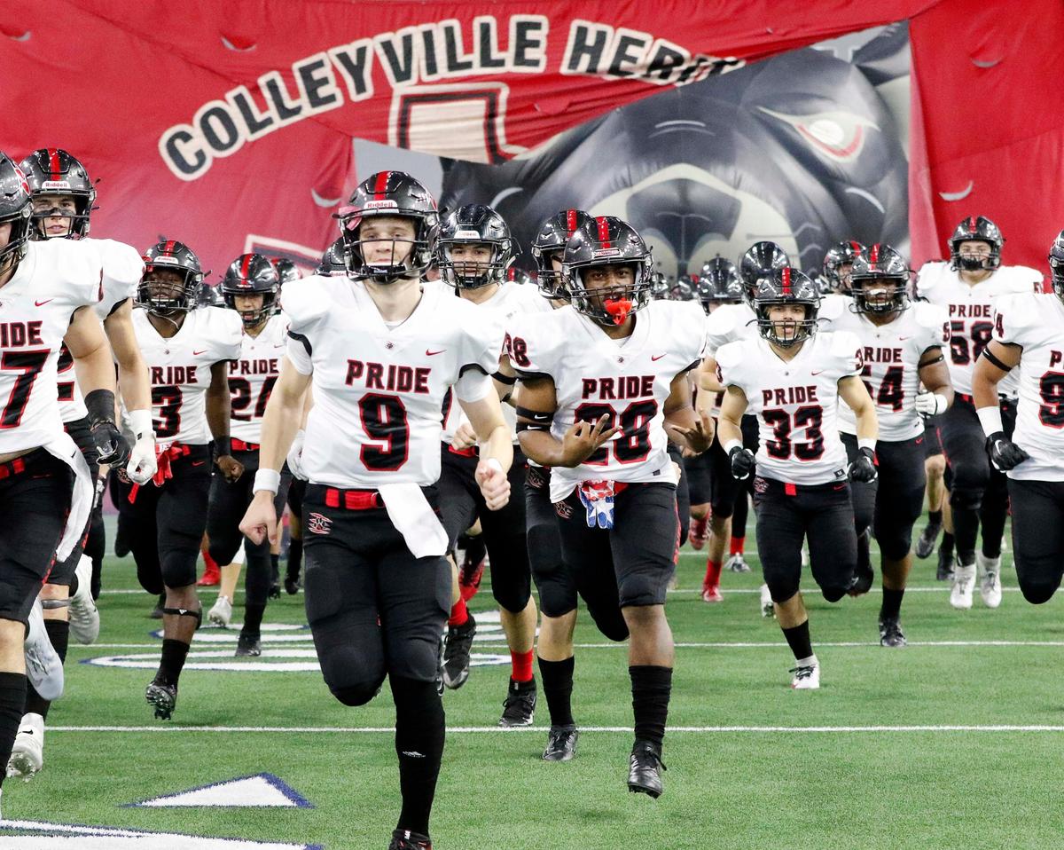 Colleyville Heritage Panthers enter the field for the start of the 5A Division I Regional Round high school football playoff game at The Star in Frisco, Texas, Saturday, Nov. 30, 2019. After one quarter of play Birdville led 7-3. (Special to the Star-Telegram Bob Booth)