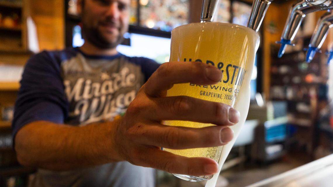 Jon Powell, president, pours an Aluminum Cowboy beer in the Hop & Sting Brewing Co. taproom on Thursday, May 26, 2022, in Grapevine. The brewery was selected as the reader’s choice in the Star-Telegram’s Best Brewery in Fort Worth competition.