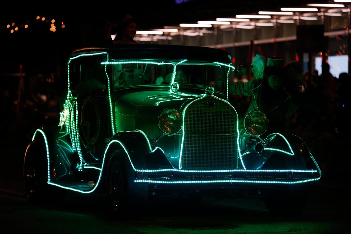 An antique car lined in lights during the 2024 Parade of Lights in Fort Worth.