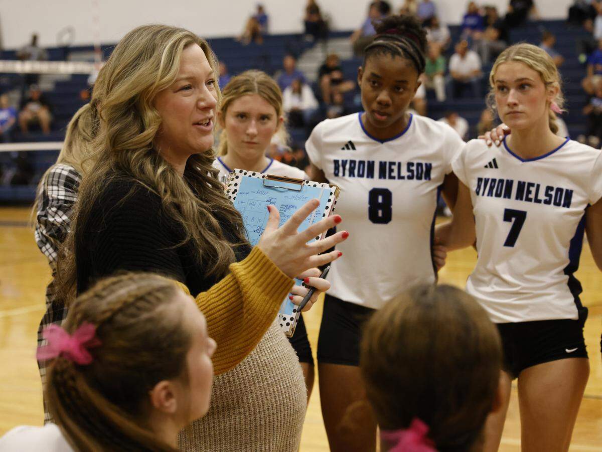 Byron Nelson volleyball coach Brianne Groth talks to the team during the fourth set at Keller on Oct. 14.